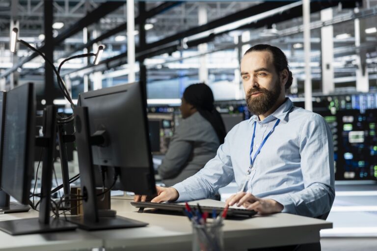 IT Tech Support specialist monitoring hotel systems to ensure tech support 24/7.